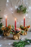 Red advent flower arrangement with three burning candles royalty free stock photos Red advent flower arrangement with three burning candles royalty free stock photos