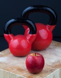Red Apple And Kettlebells On Chopping Board Stock Image Red Apple And Kettlebells On Chopping Board Stock Image