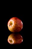 Red Apple On A Black Reflective Background Stock Photography Red Apple On A Black Reflective Background Stock Photography