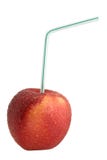 Red Apple With Drinking Straw Royalty Free Stock Photos