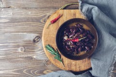 Red bean stew served in a bowl, cutting board, napkin. Top view, copy space. stock photography Red bean stew served in a bowl, cutting board, napkin. Top view, copy space. stock photography