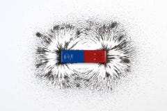 Red and blue bar magnet or physics magnetic with iron powder mag
