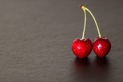 Red cherries with dripping royalty free stock photography Red cherries with dripping royalty free stock photography