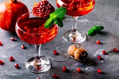 Red cocktail with sparkling wine and pomegranate seeds Royalty Free Stock Photos Red cocktail with sparkling wine and pomegranate seeds Royalty Free Stock Photos