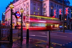 Red double decker bus in motion blur at Piccadilly Circus in London, UK, at night Royalty Free Stock Images Red double decker bus in motion blur at Piccadilly Circus in London, UK, at night Royalty Free Stock Images