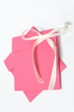 Red envelope with yellow ribbon in the shape of a bow for CD, vertical position . square envelope stock photography Red envelope with yellow ribbon in the shape of a bow for CD, vertical position . square envelope stock photography