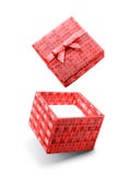 Red flying open gift box with satin bow royalty free stock images Red flying open gift box with satin bow royalty free stock images
