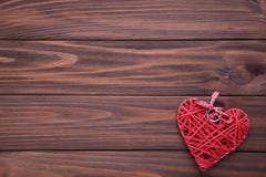 Red heart on a brown wooden table. Valentines day stock image Red heart on a brown wooden table. Valentines day stock image