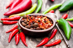 Red Hot Chili Peppers And Other Spices In A Small Plate On Wood Royalty Free Stock Image Red Hot Chili Peppers And Other Spices In A Small Plate On Wood Royalty Free Stock Image