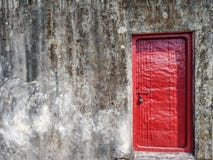 A red lock door on an old wall with some space for text royalty free stock photography A red lock door on an old wall with some space for text royalty free stock photography