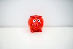 Red piggy bank for saving stock photo Red piggy bank for saving stock photo