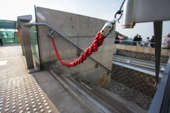 Red rope like do not enter sign. unauthorized entry is prohibited. Closeup, shallow focus. stock photo Red rope like do not enter sign. unauthorized entry is prohibited. Closeup, shallow focus. stock photo