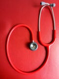 Red stethoscope on red leather bench royalty free stock images Red stethoscope on red leather bench royalty free stock images