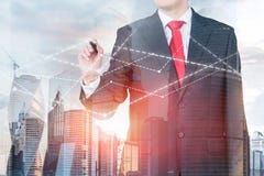 Red tie businessman drawing graph in city royalty free stock photo Red tie businessman drawing graph in city royalty free stock photo