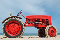 Red Tractor On A Beach Royalty Free Stock Photos