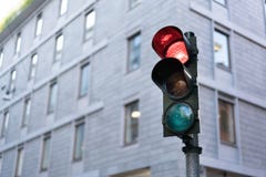Red Traffic light in downtown with clipping path and copy space. Urban traffic or modern city life concept