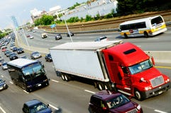 Red truck in the highway. Red cargo truck in the highway Red truck in the highway. Red cargo truck in the highway