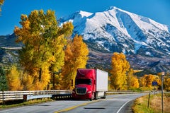 Red Truck On Highway In Colorado At Autumn Royalty Free Stock Photography