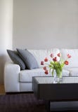 Red tulips in modern living room - home decor