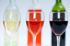 Red, White And Rose Wine In Glasses With Bottles Behind Stock Images Red, White And Rose Wine In Glasses With Bottles Behind Stock Images