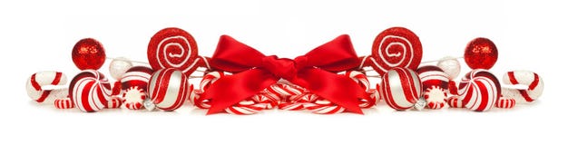 Red and white Christmas baubles, bows and candy cane border stock image Red and white Christmas baubles, bows and candy cane border stock image