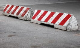 Red and white striped concrete road barriers royalty free stock photo Red and white striped concrete road barriers royalty free stock photo