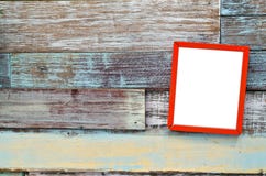Red Wooden Frame Hanging On A Wooden Board Stock Images