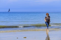 Redhed woman on the seashore stock photography Redhed woman on the seashore stock photography