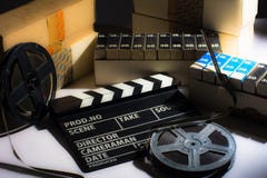 Reel with film and cinema clap Royalty Free Stock Images Reel with film and cinema clap Royalty Free Stock Images