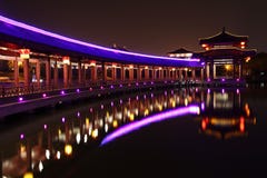 Reflection Of The Tang Paradise Center At Night, Xi An, China Stock Photo