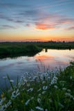 Reflections of colorful clouds in the water of a canal in the dutch countryside royalty free stock photos Reflections of colorful clouds in the water of a canal in the dutch countryside royalty free stock photos