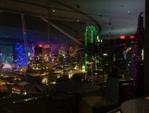 Reflections on glass windows and downtown Dallas view from Reunion Tower Geo deck