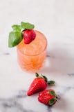 Refreshing strawberry and basil cocktails on white marble surface royalty free stock images Refreshing strawberry and basil cocktails on white marble surface royalty free stock images