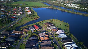 Regatta Waters On The lake and Parkland Gold Coast Grass play area House Estate next to Coomera River On The lake, Stock Images Regatta Waters On The lake and Parkland Gold Coast Grass play area House Estate next to Coomera River On The lake, Stock Images