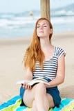 Relaxed Woman With Book On Beach Stock Image Relaxed Woman With Book On Beach Stock Image