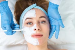 Relaxed young woman is getting facial skin care treatment at bea royalty free stock images Relaxed young woman is getting facial skin care treatment at bea royalty free stock images