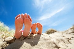 Relaxing feet on the beach