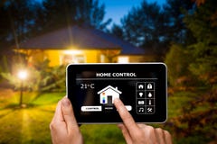 Remote home control system on a digital tablet. stock photo Remote home control system on a digital tablet. stock photo