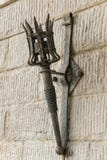 Removable iron torch on a medieval castle stone wall royalty free stock images Removable iron torch on a medieval castle stone wall royalty free stock images