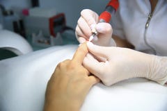 Sawing nails removing manicure royalty free stock image Sawing nails removing manicure royalty free stock image