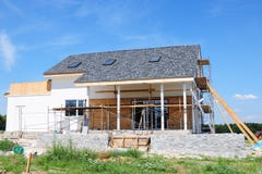Renovation house with asphalt shingles roofing construction, painting wall, stucco, wall repair, insulation, attic skylight royalty free stock photography Renovation house with asphalt shingles roofing construction, painting wall, stucco, wall repair, insulation, attic skylight royalty free stock photography