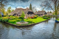 Dutch village with colorful ornamental garden and spring flowers, Giethoorn Royalty Free Stock Photo Dutch village with colorful ornamental garden and spring flowers, Giethoorn Royalty Free Stock Photo