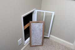 Replacing clean Air filter for home air conditioner royalty free stock photography Replacing clean Air filter for home air conditioner royalty free stock photography