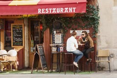 Restaurant in Paris. People in a french restaurant - Paris, France Restaurant in Paris. People in a french restaurant - Paris, France