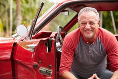 Retired Senior Man Sitting In Restored Classic Car royalty free stock photos Retired Senior Man Sitting In Restored Classic Car royalty free stock photos