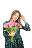 Retrato da moça de sorriso com as tulipas bonitas no branco Dia internacional do ` s das mulheres fotografia de stock Retrato da moça de sorriso com as tulipas bonitas no branco Dia internacional do ` s das mulheres fotografia de stock