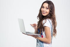 Retrato de uma menina de sorriso que guarda o laptop fotos de stock Retrato de uma menina de sorriso que guarda o laptop fotos de stock