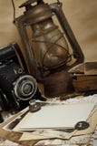 Retro Camera, Kerosene Lamp And Old Photos Stock Photos
