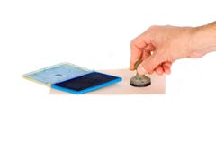 A man`s hand puts a stamp on a document on a white isolated background. The concept of business transactions. royalty free stock images A man`s hand puts a stamp on a document on a white isolated background. The concept of business transactions. royalty free stock images