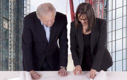 Reviewing Blueprints Stock Photo